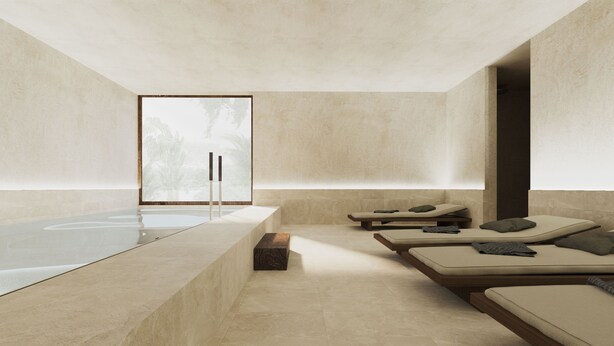 Un cuarto de spa con una bañera grande, dos camillas de masaje y un banco de madera pequeño.