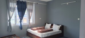 Desk, laptop workspace, blackout drapes, soundproofing