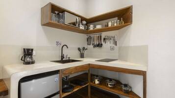 Fridge, microwave, stovetop, coffee/tea maker