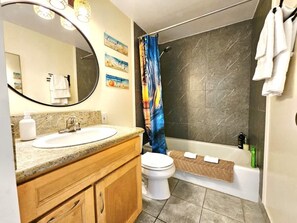 Shower, hair dryer, towels, shampoo