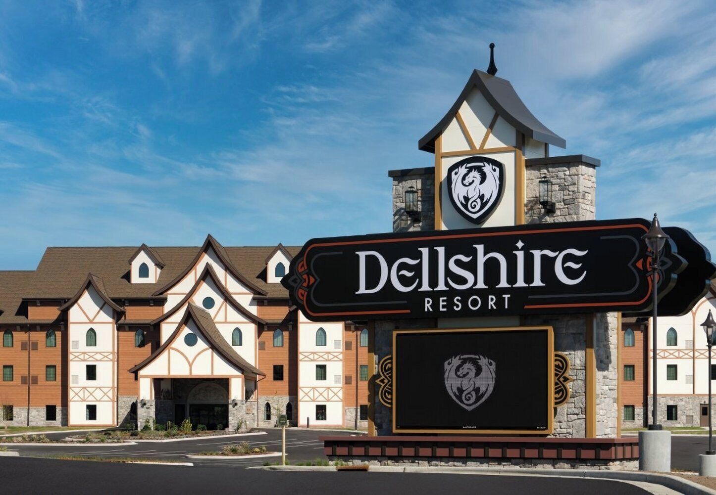 A hotel entrance with a sign reading 'Dellshire Resort' and a logo above it.