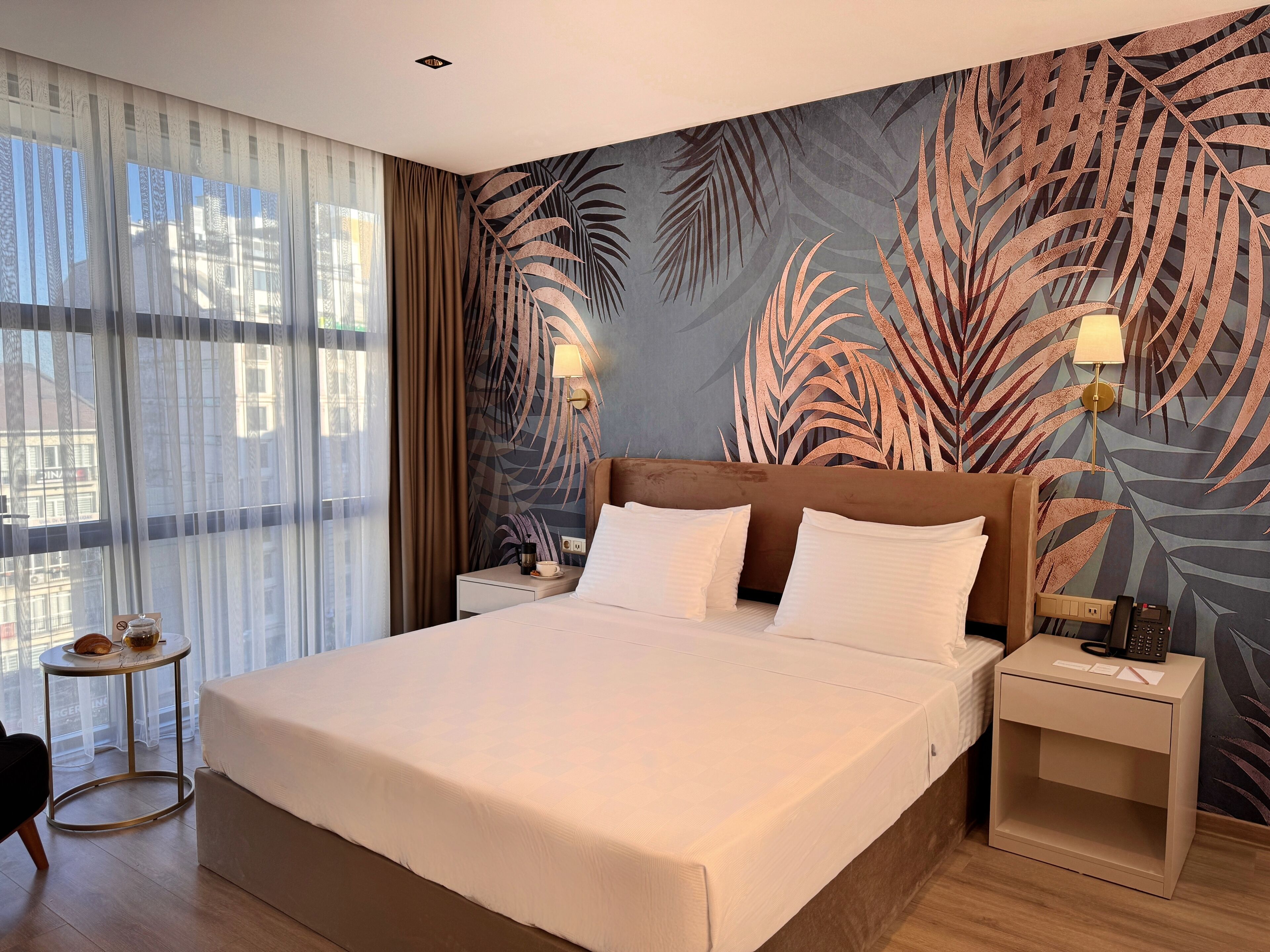 Habitación Deluxe | Ropa de cama de alta calidad y minibar 