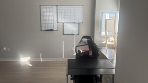 A room with a desk, a chair, and a whiteboard with diagrams. - Modern 2BR/2BTH near DC; Walk to Mall, Shops & Metro! (Hyattsville)