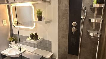 Shower, towels, soap, toilet paper