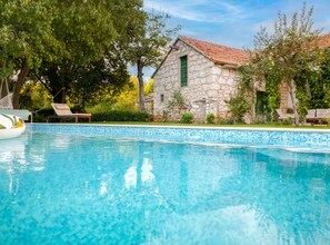 A clear blue pool with a stone building in the background. - Villa Mima Pool Retreat - Five Bedroom Villa With Pool (Lovreć)