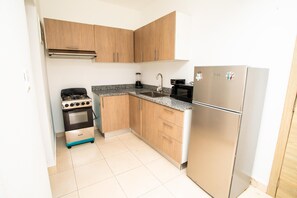 Private kitchen - Cozy apartment with pool just minutes from Playa Dorada (Villa Montellano)