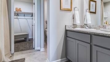 Shower, jetted bath, bidet, towels