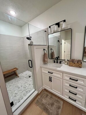 Shower, hair dryer, towels, soap