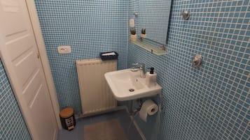 Shower, free toiletries, hair dryer, slippers