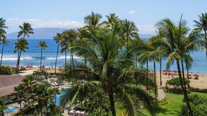 A resort with a pool, beach area, and palm trees. - Wake Up With Ocean Views - Professionally Managed (Lahaina)