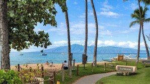 A pathway leading to a beach with a sign reading "The Westin". - Wraparound Oceanfront Views | Sleeps 8 | Resort Amenities Included (Lahaina)