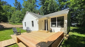 A two-story house with a deck, a covered porch, and a large window. - Renovated 3BR Home near  High Falls / Stone Ridge (Accord)