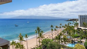 A beach resort with a view of the ocean, palm trees, and a mountain in the background. - Ocean Views & Resort Amenities at Kaanapali Alii w/ Private Lanai (Lahaina)