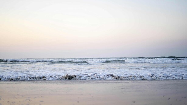 A beach with waves and a clear sky. - Wildwood Waves - 2BR Apt - Steps from Beach (Wildwood)
