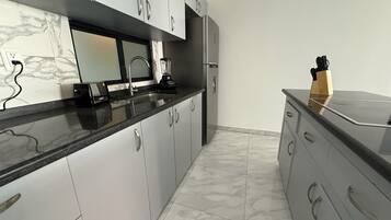 Fridge, microwave, stovetop, coffee/tea maker