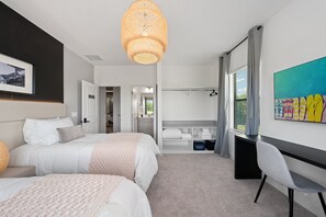 A modern hotel room with two beds, a desk, and a large window. - Brand New Modern State of the Art Home Sleeps 31 (Kissimmee)