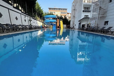 Seasonal outdoor pool, pool umbrellas, sun loungers