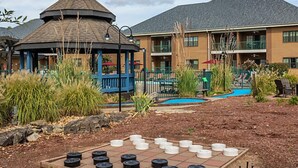 A gazebo, a pool, and a building with multiple balconies. - BLOCK Falls Village 1br (Angels Camp)