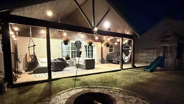 A covered patio area with a fire pit, outdoor seating, and a play structure. - One story 4 bedroom updated ranch in the middle of it all. (Simpsonville)