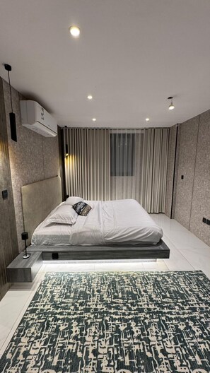 Suite de lujo, vistas a la playa | Tabla de planchar con plancha y wifi gratis