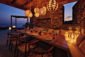 Outdoor dining - Heavenly views from Villa Nites with stunning infinity pool (Megas Gialos)