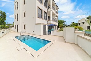 Outdoor pool - New Gated Luxury 2BR 2BA Condo, Pool, Rooftop Close to Beaches & Restaurants. (Bridgetown)