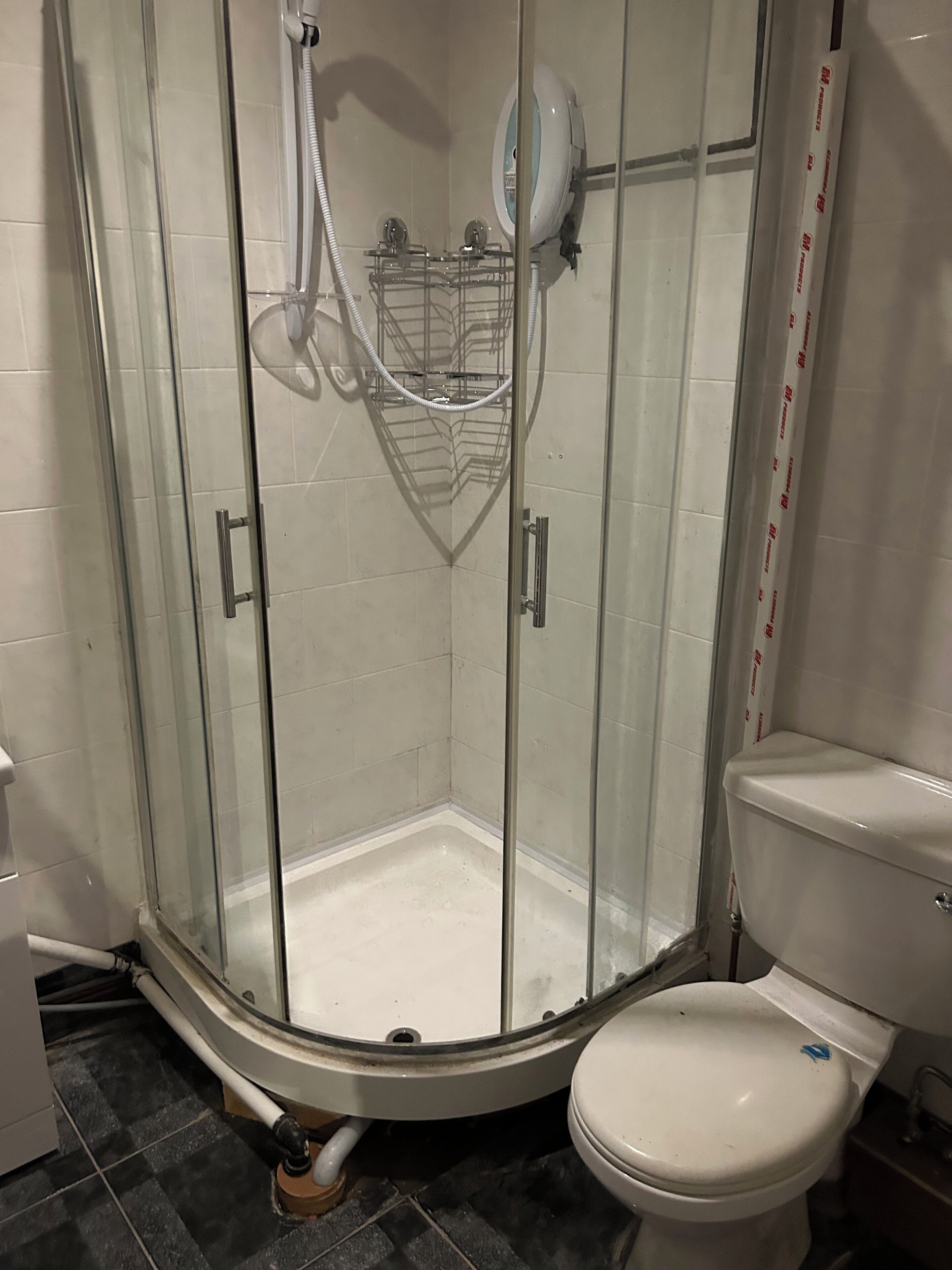 Shower, hair dryer, soap, toilet paper