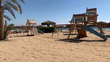 On the beach, sun-loungers, beach towels