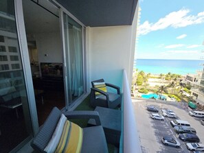A balcony with a view of the ocean and a parking area. - Stunning Beachside Ocean View Unit-CS70 (Hollywood)