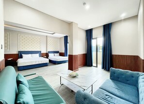 Family Room, Balcony, Beach View | In-room safe, soundproofing, iron/ironing board, free WiFi