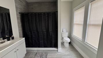 Shower, towels, soap, toilet paper