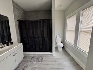 Shower, towels, soap, toilet paper