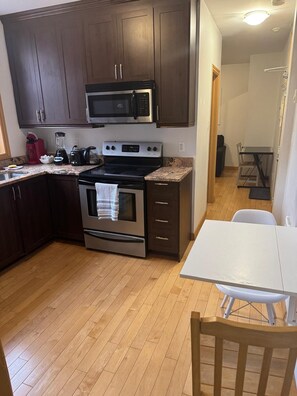 Fridge, microwave, stovetop, coffee/tea maker