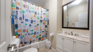 A bathroom with a toilet, sink, and bathtub. - 2-Bed App Downtown Ottawa 36D (Ottawa)