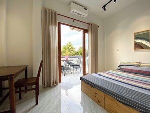 Deluxe Room, Balcony, Garden View | Blackout curtains, free WiFi, bed sheets - T HOUSE HOMESTAY TIEN GIANG  (Chau Thanh)