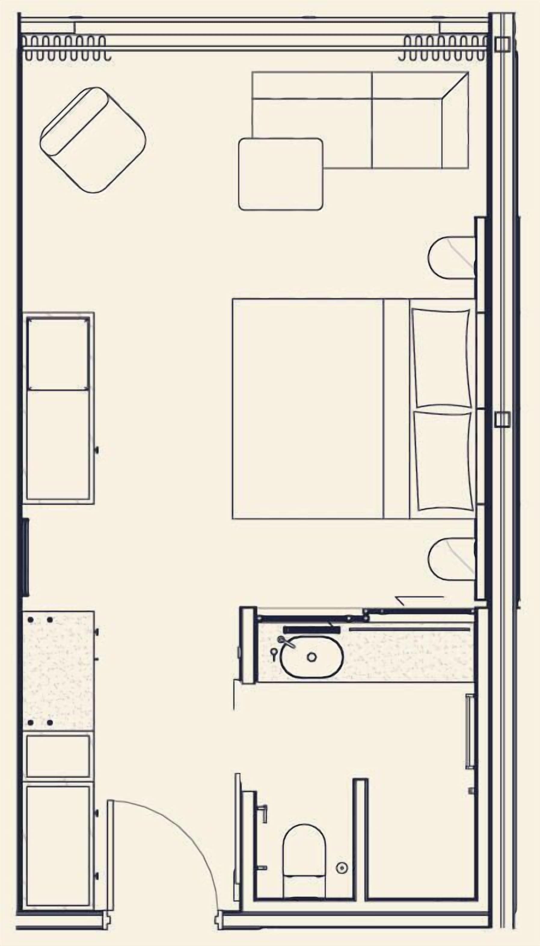 Ein Grundriss eines Hotelzimmers mit Bett, Schreibtisch, Stuhl, Kleiderschrank und Badezimmer.