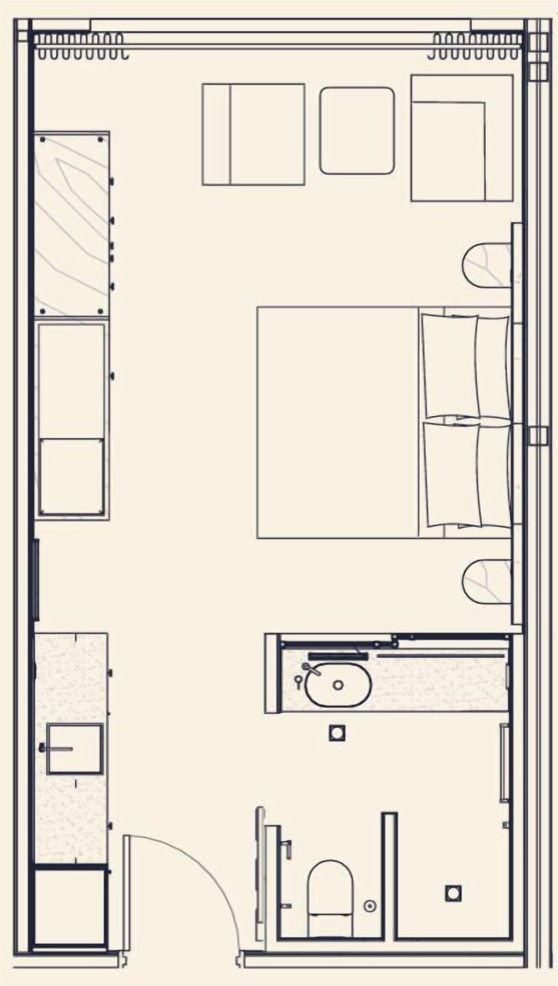 Plano de planta de una habitación de hotel con cama, escritorio, silla, baño y una pequeña zona de estar.