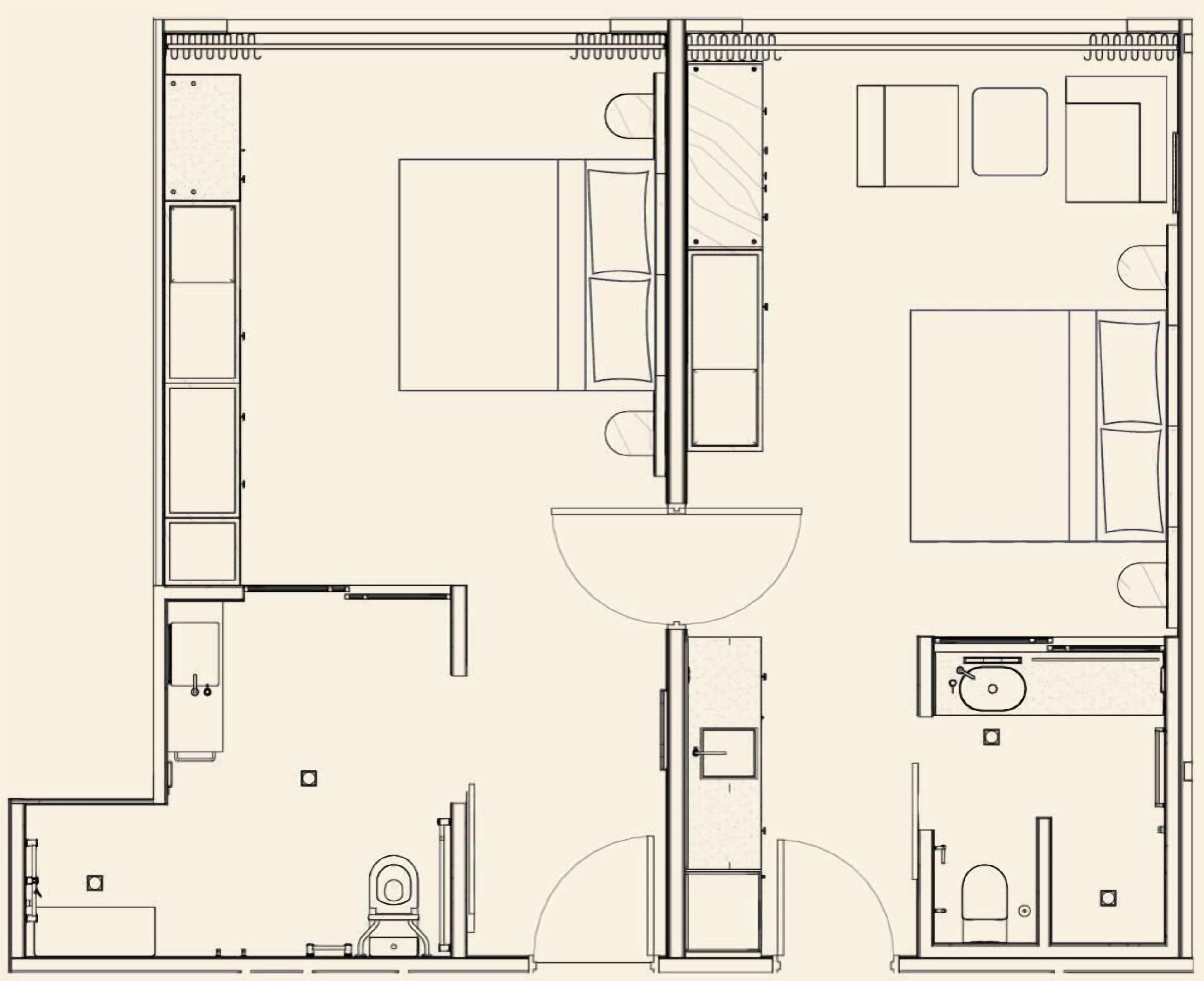 Plano de planta de una habitación de hotel con cama, baño, kitchenette y zona de estar.