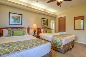 A hotel room with two beds, a ceiling fan, and artwork on the walls. - Kapalua Bay | Ocean View 3 BR, Sleeps 10 | Car Incl. w/ 6+ Nights | KBV ML-1987 by KBM (Lahaina)