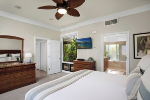 A bedroom with a bed, dresser, ceiling fan, and a TV on the wall. - Kapalua Bay | Ocean View 3 BR, Sleeps 10 | Car Incl. w/ 6+ Nights | KBV ML-1999 by KBM (Lahaina)