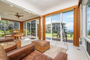 A spacious living area with leather sofas, a coffee table, and a telescope on a balcony. - Kapalua Bay | Ocean View 3 BR, Sleeps 10 | Car Incl. w/ 6+ Nights | KBV ML-1999 by KBM (Lahaina)