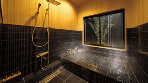A modern bathroom with a wooden interior, a large window, and a hot tub. - TAKENOYADO BEPPU (Beppu)