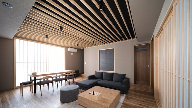 A modern living room with a sectional sofa, a wooden coffee table, and a dining area with a table and chairs. - TAKENOYADO BEPPU (Beppu)