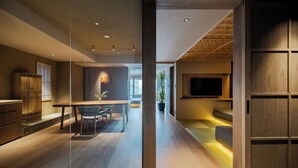 A modern interior with a dining area, kitchen, and seating space. - MOKU Kyoto (Kyoto)