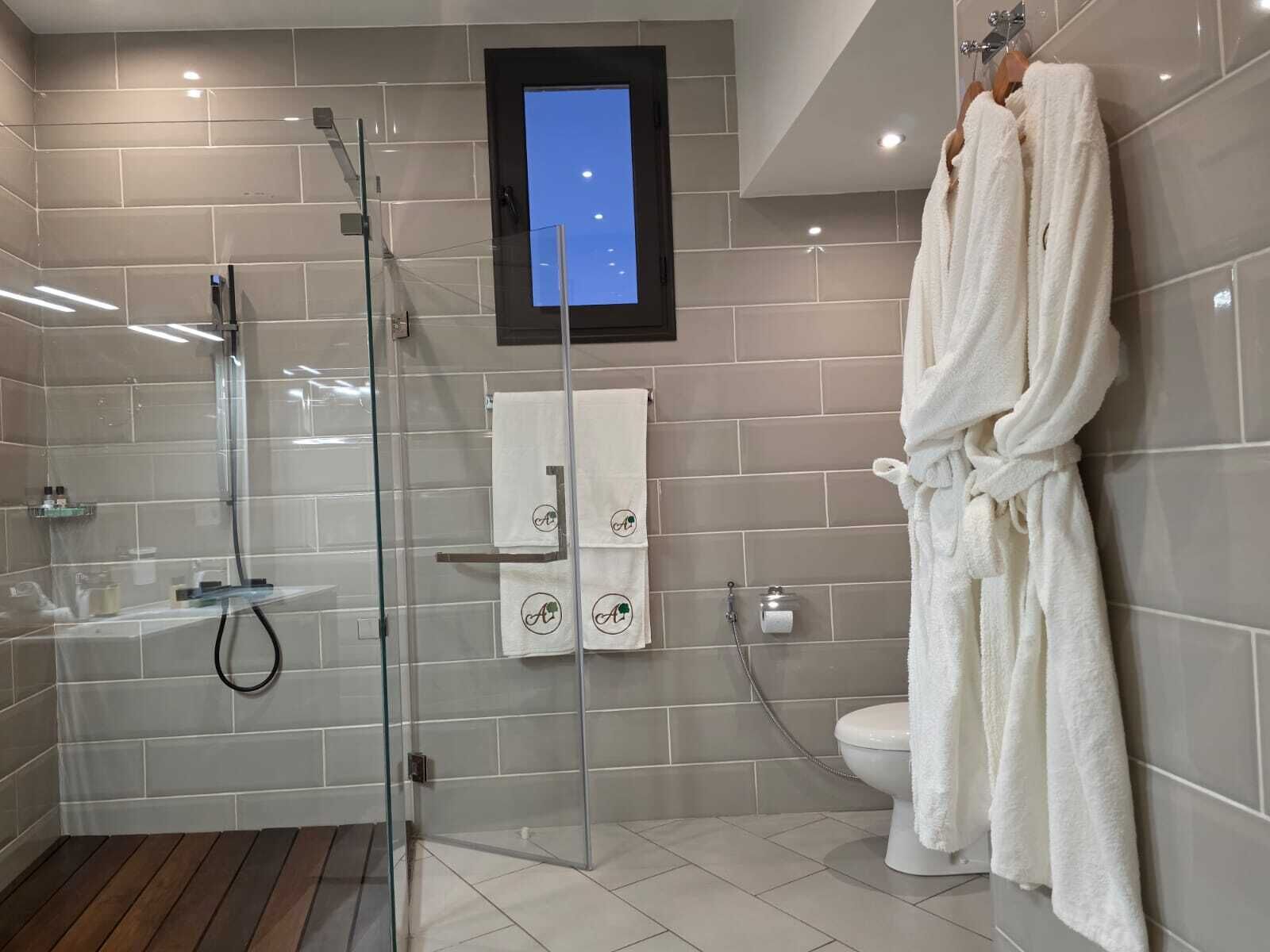 Superior Suite, Balcony, City View | Bathroom | Shower, rainfall showerhead, designer toiletries, hair dryer