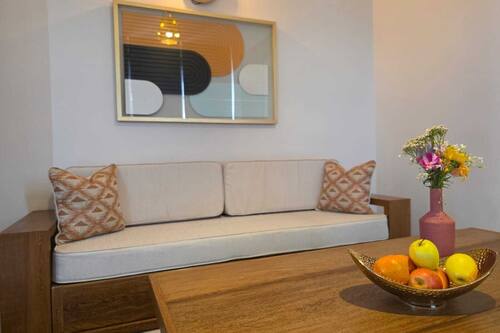Superior Suite, Balcony, City View | Living area | 70-inch flat-screen TV with cable channels, pay films