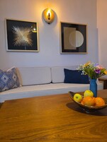 Deluxe Suite, Balcony, City View | Living area | 70-inch flat-screen TV with cable channels, pay movies