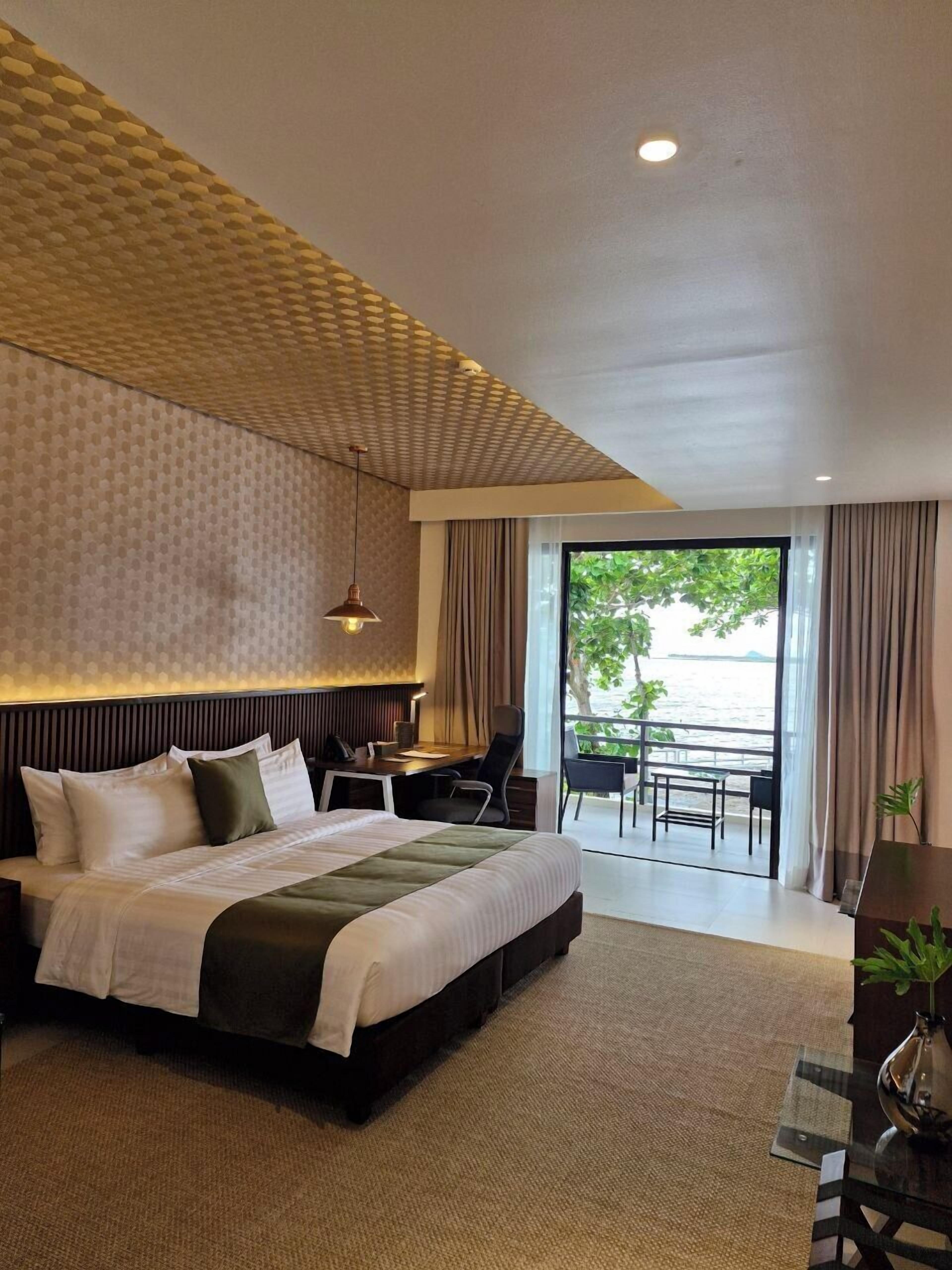 Exclusive Suite, Balcony, Pool View | In-room safe, desk, laptop workspace, blackout drapes