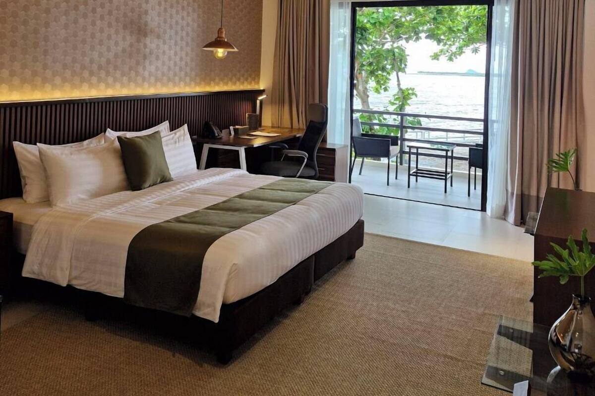 Suite, Balcony, Pool View | In-room safe, desk, laptop workspace, blackout drapes