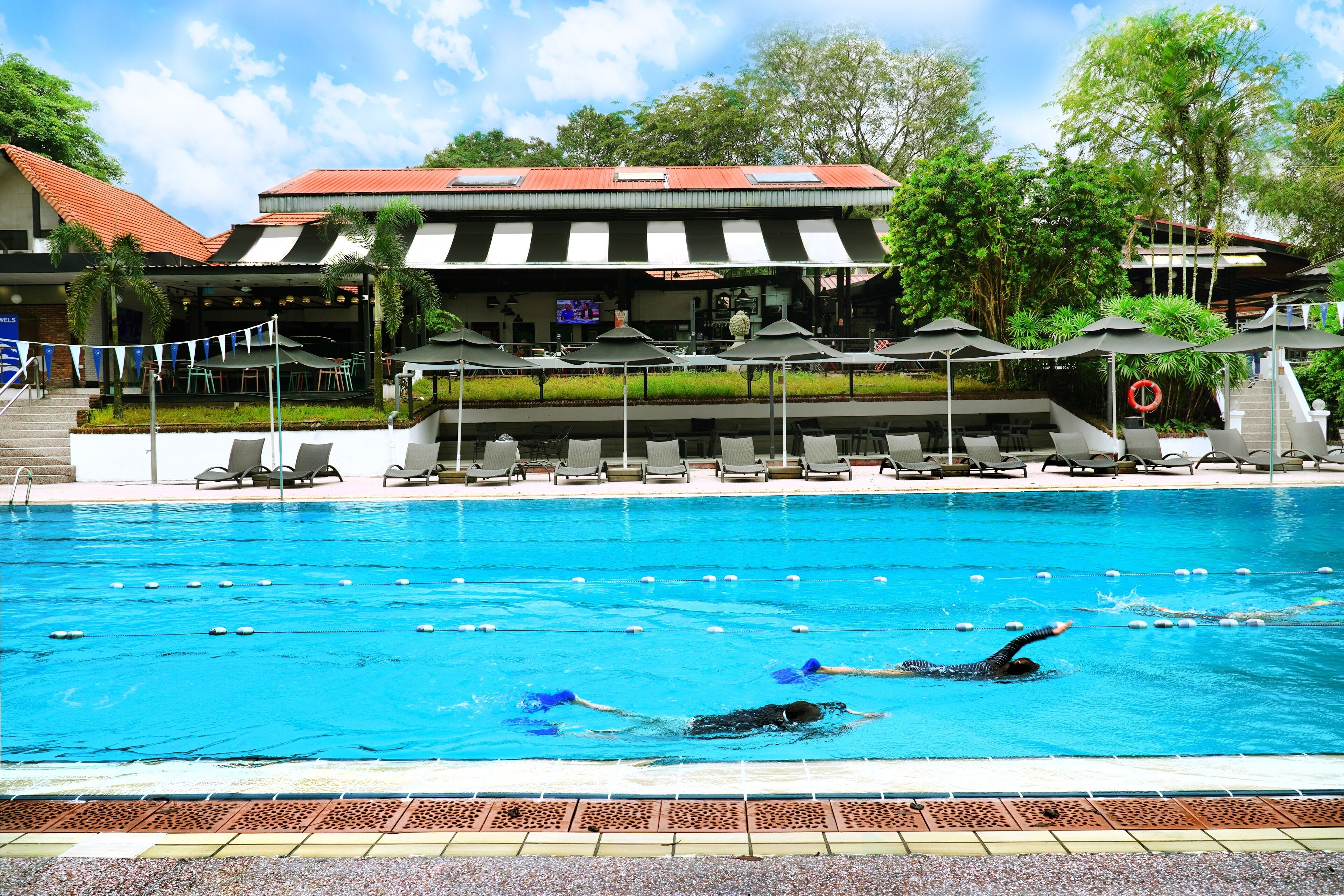 2 outdoor pools, open 7:00 AM to 10:00 PM, pool umbrellas, pool loungers